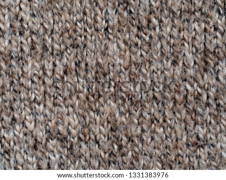 Light brown handmade wool knitting pattern macro details