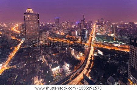 Cityscape at night in Bangkok with electric train(BTS).