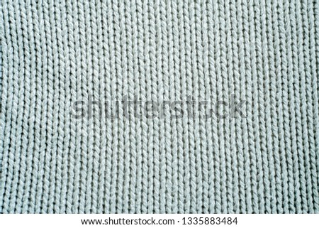 Knitwear, fabric textures and rustic lifestyle concept - Knitted winter clothes