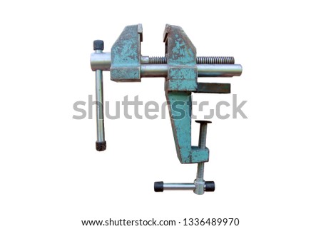 iron metal heavy locksmith steel vise on the workbench in the open state close-up side view isolated on white background