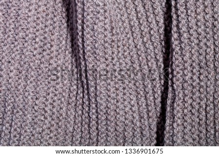 Knitted brown scarf texture background.