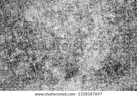 Monochrome texture of the brush strokes with a dry brush in grunge style. Black and white vintage texture of the old surface. Chaotic dirty pattern of chips, scuffs, cracks, faded