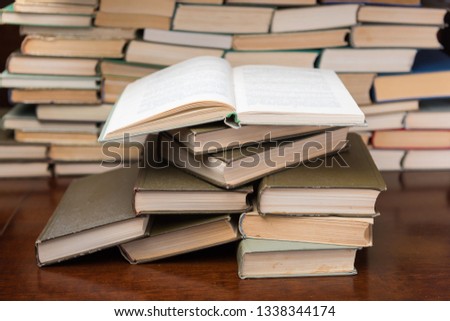 stack of books on the wooden table
