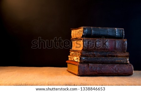 old books with covers made of leather