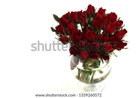 Bouquet of red rose in grass vase isoleted on white