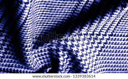 Background texture, pattern. The fabric is thick, warm with a checkered pattern,