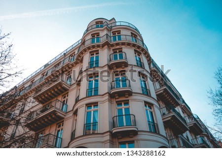 beautiful and luxury corner building from the low angle view at berlin with small french balcony