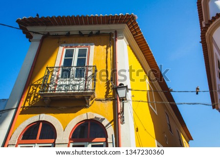 old yellow house with balcon in Coimbra, Portugal