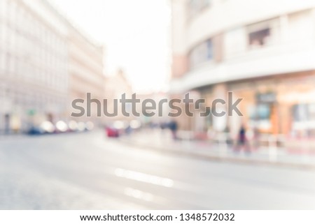 BLURRED CITY STREET WITH CURVING ROAD, OUTDOOR BACKGROUND