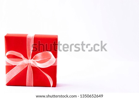 Mother Day concept. Gift box on white table  background. Backdrop with empty space for text.