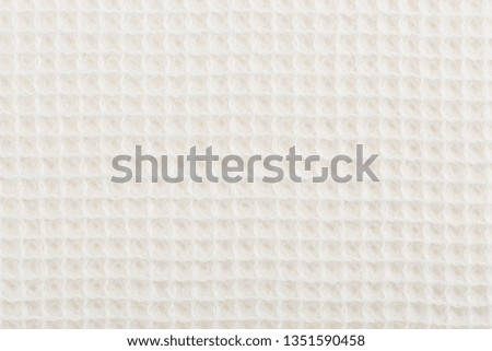 White corrugated cotton textile - close up of fabric texture. Cotton Fabric Texture. White Clothing Background. Text Space. Abstract background and texture for designers.