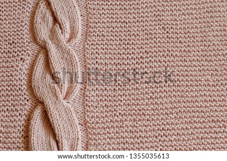 Exclusive delicate pink knitted background with vertical knitted oblique. Handmade. Minimal style.