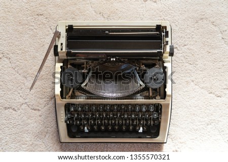 Vintage typewriter on white textured fabric background . retro style and Antiques. subject photography