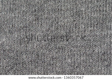 Texture of gray knitted fabric closeup