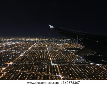 blurred view of city from plane at night