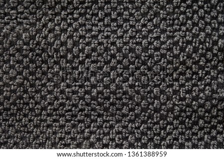 the texture of the towel in dark grey fabric