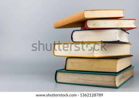 Stack of old books on gray background.Education learning and reading concept.Not too late to learn.

