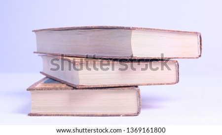 stack of books.isolated on blue background. photo with copy space