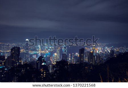 Panorama of Hong Kong at night. View of Victoria Harbor from Victoria Peak.