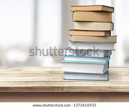 Collection of old books on wooden table