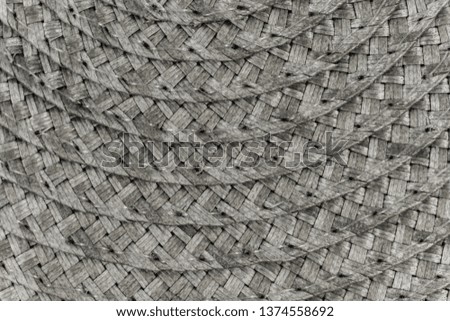 Woven black and grey wicker straw background or texture