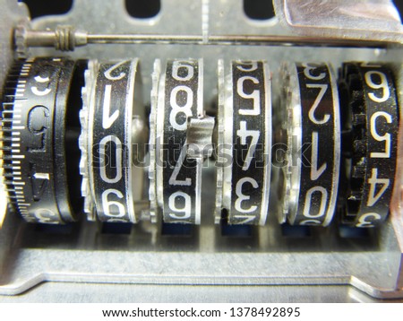 Closeup (macro) of mechanical counting unit used in electric meter (power meter, electricity meter) in cold light