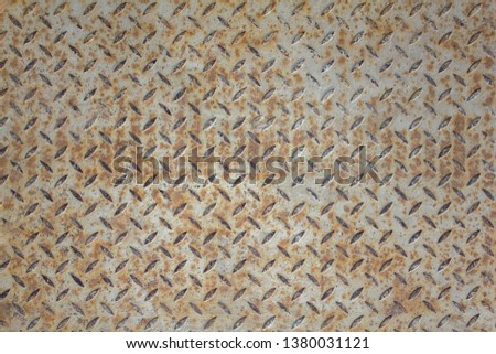white gray metal sheet with a diagonal pattern and brown rust. rough surface texture