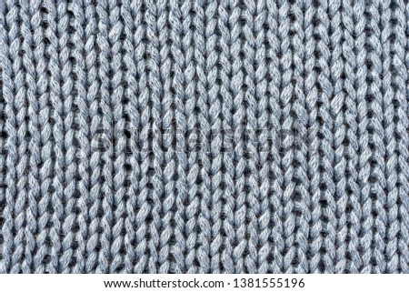 Knitted blue craft macro background