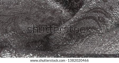 Texture background, pattern. white brocade fabric. Organza brocade fabric - shepherd, with a crunchy palm. It has a large yarn-dyed flower embroidered pattern throughout.