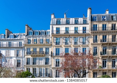 Paris, beautiful buildings in the center, typical parisian facades in the Marais 
