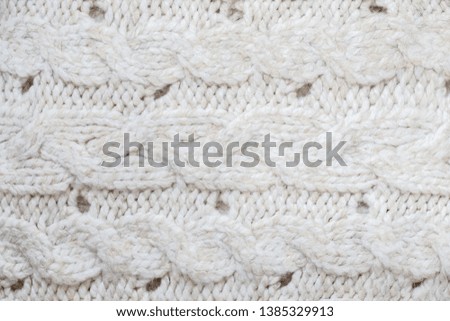 Texture background of soft fluffy knitted plaid