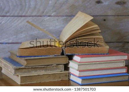 Close-up pictures of old books open on old books selective focus and shallow depth of field