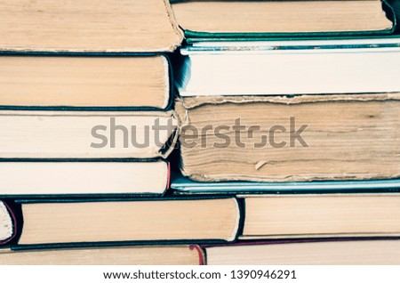 Stack of books, distance home education background at home during the pandemic. The quarantine concept of stay home self-isolation, social distancing, work from home concept stop coronavirus COVID-19