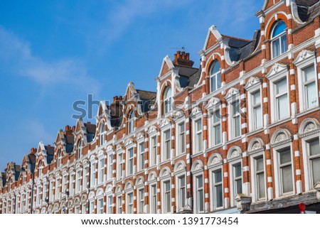 Facade of English row terrace houses on Muswell hill broadway, London