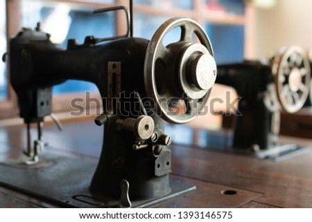 sewing machine,old sewing machine,vintage style,soft focus.