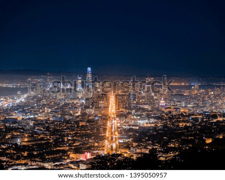 Cityscape at night with office buildings and high-rise skyscrapers