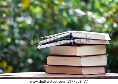 book wooden table tree background 