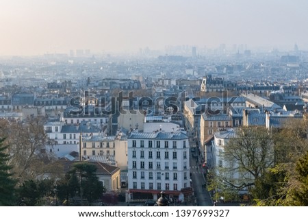 Paris, panorama of the city, from Montmartre hill, typical roofs, in the mist
