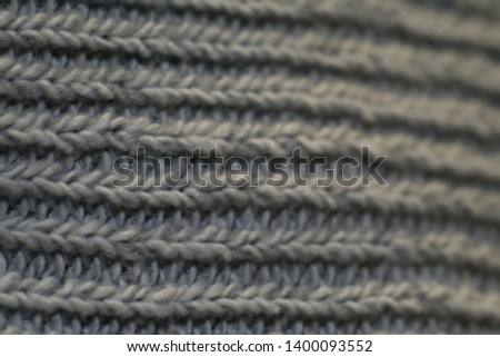 Lines of weaved woollen scarf under macro lens