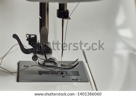 sewing machine with needle and thread