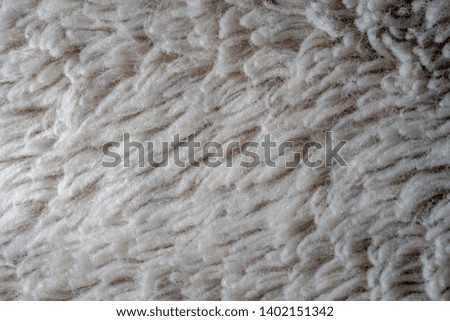 The gray fabric of the blanket
