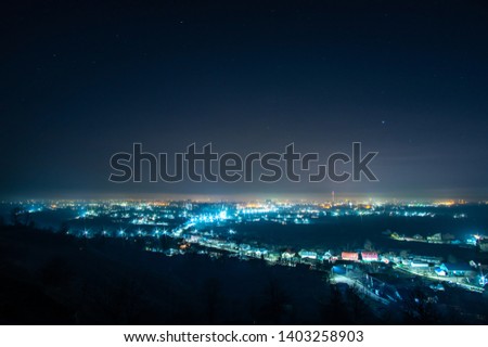 Night European city in the haze