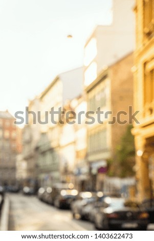 Blurred background of European street. Sunny bokeh concept.