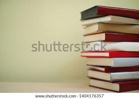 Stack of red books on shelf