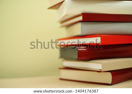 Stack of red books on shelf
