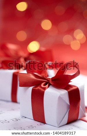 presents for Valentine day with red ribbons