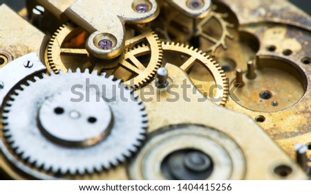 Gears of a vintage metal business clock watch close-up, time mechanism web banner