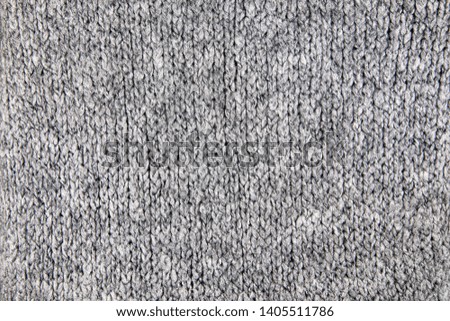 Loose Knitwear Fabric Texture with wool fibers. Repeating Machine Knitting Texture of warm Sweater. Grey Knitted Background.