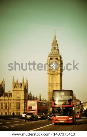 Double-deck red bus on Westminster Bridge with Big Ben in London.