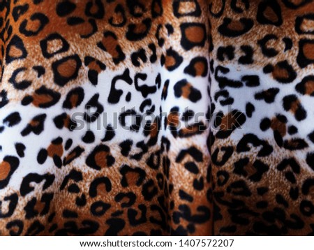 Closeup Leopard leather fabric background.